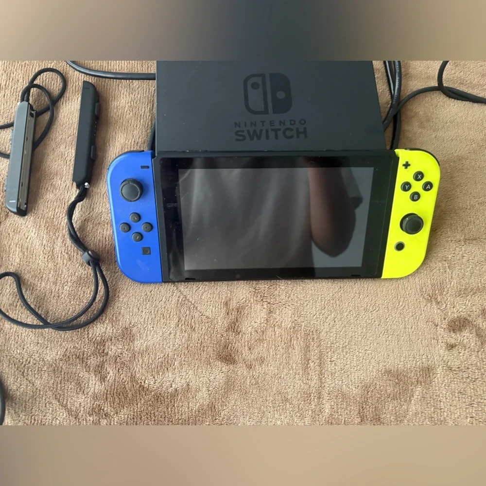 Nintendo Switch with Blue, Yellow and Gray Joy-Con